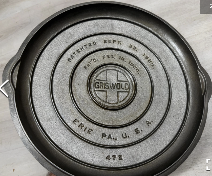 Underside of Griswold number 12 low dome cast iron fully-marked skillet cover lid, pattern number 472. Large block logo EPU (Erie, PA., U.S.A.) Sold for $475. 